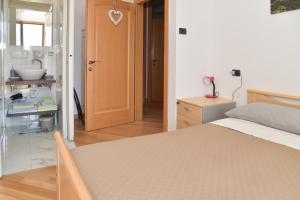 Postel nebo postele na pokoji v ubytování B&B agli Ulivi