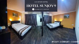 Voodi või voodid majutusasutuse Hotel Sunjoy9 Klang toas