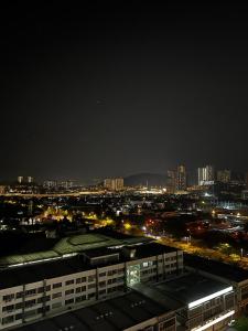 a view of a city at night with buildings at Zetapark, The Loft in Kuala Lumpur