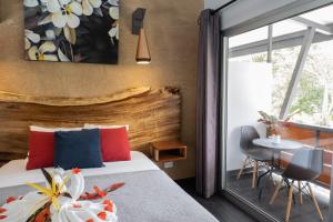 Voodi või voodid majutusasutuse Hotel FAREMITI Uvita toas