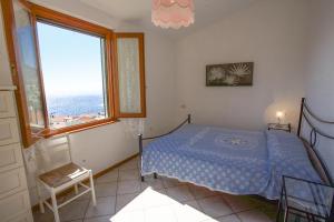 Ένα ή περισσότερα κρεβάτια σε δωμάτιο στο Villetta La Terrazza
