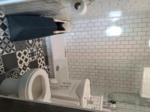 a bathroom with a white toilet and a mirror at Apartment - Sleeps 4 - Pet friendly - Parking in Troon +33 photos
