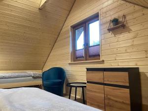 Posteľ alebo postele v izbe v ubytovaní Domki Pod Beskidem