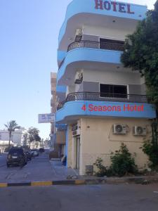 a hotel with a sign that reads four seasons hotel at Four Seasons Hotel in Hurghada