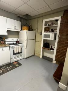 a kitchen with a white refrigerator and a stove at Dallas Farmers Market Area, Just right in Downtown in Dallas