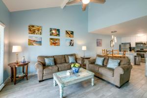 a living room with two couches and a coffee table at Bright Key Allegro Condo with Community Outdoor Pool in Rockport