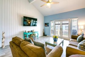 a living room with two couches and a table at Bright Key Allegro Condo with Community Outdoor Pool in Rockport