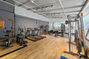 a gym with several treadmills and cardio machines at Higienópolis The Standard Residence in Sao Paulo