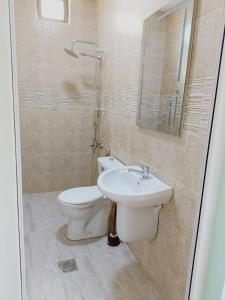 a bathroom with a toilet and a sink at lacasa chalet private With a panoramic view of the DeadSea in Sowayma