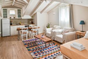 a living room with a couch and a table at Old Town Apartment in Corfu Town