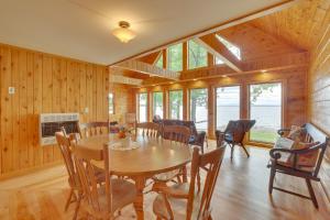 a dining room with a wooden table and chairs at Lake Champlain Vacation Rental with Boat Dock! in Melville Landing