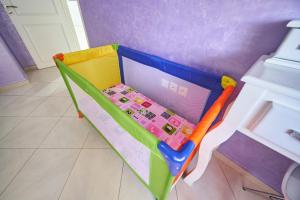 a toy bed with a laptop on it in a room at Apartment for rent with 2 bedrooms in Tangier