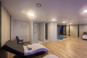 a room with a bed and a chair in it at Graziella Gold Hotel in Istanbul