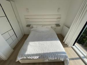 Postel nebo postele na pokoji v ubytování Morderno CityStay London
