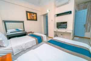 Postel nebo postele na pokoji v ubytování UMET Seaview Hotel with Free Airport Pick up and Drop T&C Apply