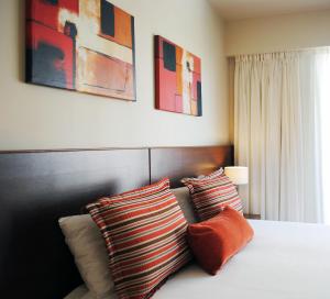 Ένα ή περισσότερα κρεβάτια σε δωμάτιο στο Palermo Suites Buenos Aires Apartments