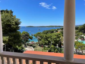 a view of the water from a balcony at Apartments Villa Dinka in Hvar