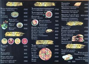 a menu for a restaurant with food on it at Hotel Gold in Gyumri