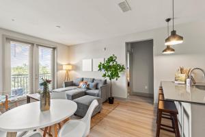 a living room with a couch and a table at Luxury Condo in Ybor City Tampa w/Pool access in Tampa