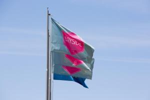 a flag with the toyota logo on it at Bayside Salgados in Albufeira