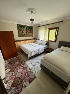Postel nebo postele na pokoji v ubytování Yeşil Doğa Tatil Apart