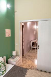 a bedroom with a door open to a room at Ritsinia Apartments in Aigio
