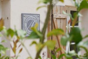 a sign on the side of a building at La Ferme D'Augustin in Saint-Tropez