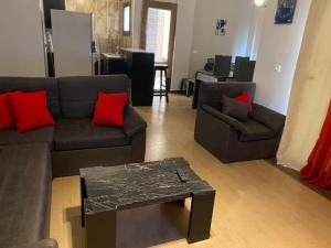 a living room with two couches and a coffee table at Apartment in Blue bay Asian Marsailla Families only chalet pool view قرية بلو باى اسيا مرسيليا العين السخنة in Ain Sokhna