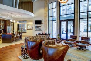 a lobby with a couch and chairs and windows at Barton Springs 1br w wd gym pool nr Town Lake ATX-189 in Austin