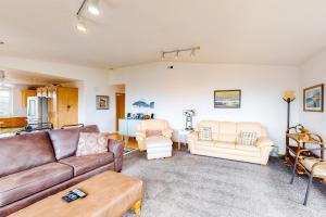 a living room with a couch and chairs at JS Beach House in Lincoln City