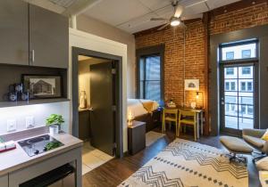 a living room with a kitchen and a room with a bedroom at Tomorrow Building at Patten Parkway in Chattanooga