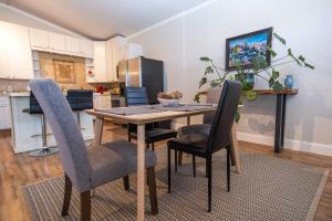 a kitchen with a dining room table and chairs at South Zion Inn and Suites in Hildale