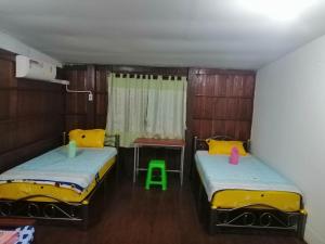 Postel nebo postele na pokoji v ubytování Lungmin homestay