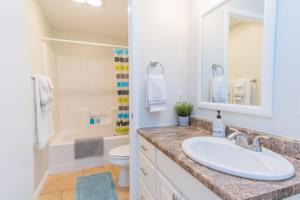 a white bathroom with a sink and a toilet at South Zion Inn and Suites in Hildale +37 photos