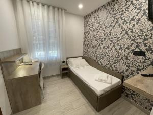 Postel nebo postele na pokoji v ubytování Hotel Altinate