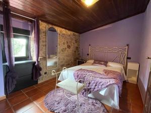 Ένα ή περισσότερα κρεβάτια σε δωμάτιο στο Casa Rural