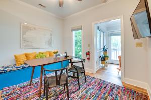 a living room with a table and chairs and a couch at Cute Georgetown Villa Less Than 1 Mi to Historic District in Georgetown