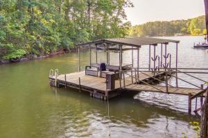 a dock in the middle of a body of water at Anderson Lakefront Vacation Rental with Boat Dock! in Anderson