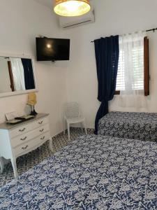 Postel nebo postele na pokoji v ubytování Hotel Rodà