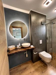 a bathroom with a sink and a mirror at Villas Park Lozenets in Lozenets +27 photos