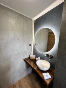 a bathroom with a sink and a mirror at Villas Park Lozenets in Lozenets