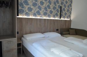 Postel nebo postele na pokoji v ubytování Hotel Altinate