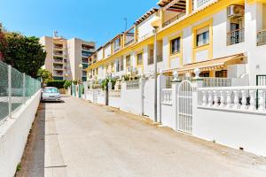 a car parked on a street next to buildings at Espanhouse Sonia in La Zenia Playas de Orihuela in Orihuela
