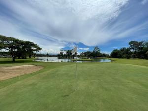 a view of a golf course with a hole at LAKE HOUSE RESORT COUNTRY CLUB & SPA in Santander de Quilichao