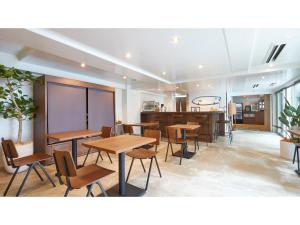 a restaurant with tables and chairs and a counter at 8HOTEL CHIGASAKI - Vacation STAY 87519v in Chigasaki