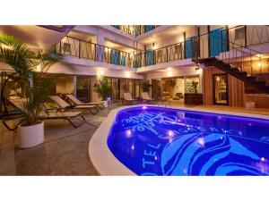 a large swimming pool in a building with a house at 8HOTEL CHIGASAKI - Vacation STAY 87565v in Chigasaki