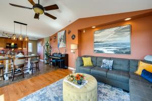 a living room with a couch and a kitchen at Waterfront Birch Bay Rental - Walk to Beach! in Blaine