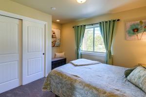 a bedroom with a bed and a window at Waterfront Birch Bay Rental - Walk to Beach! in Blaine