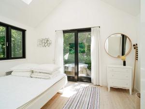Ένα ή περισσότερα κρεβάτια σε δωμάτιο στο Holiday home Tisvildeleje XV
