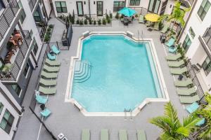 an overhead view of a swimming pool in a building at Luxury Condo in Ybor City Tampa w/Pool access in Tampa